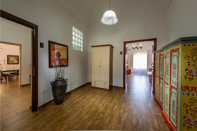 a room with a hallway with a table and a vase at Oasi del Libro in Castellammare del Golfo