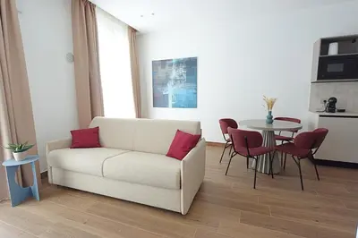 a living room with a couch and a table at Eccelso Case Vacanza in Palermo