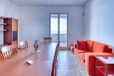 a living room with a couch and a table at Villa Mare Blu in Ficarazzi