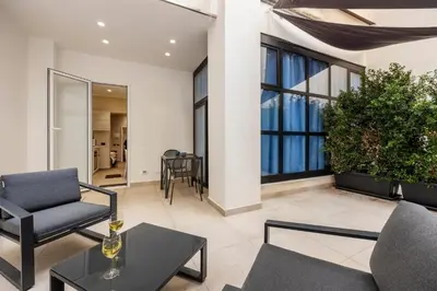 a living room with a couch and a table at Lolli Boutique & SPA Mondello in Palermo