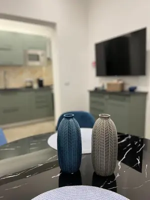 two vases sitting on top of a table at Fervore Luxury Rooms-Apartments in Palermo