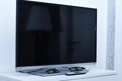 a flat screen tv sitting on top of a table at Palermo al Centro - Appartamento Fiume in Palermo
