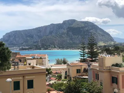 a view of a town with a mountain in the background at Le Lunette Holiday House in Palermo