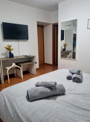 a bedroom with a bed with two towels on it at Casa Marì-Albergheria in Palermo's historic center in Palermo