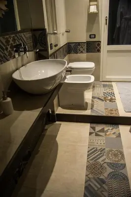 a bathroom with a sink and a toilet at Home In City in Palermo