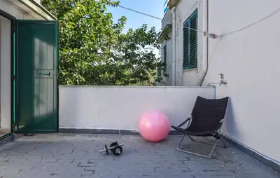 a pink balloon and a chair and a pink ball at Nice Home In Capaci With Wifi in Capaci