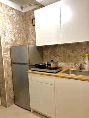 a kitchen with a refrigerator and a sink at Chic Angolo di Anita in Palermo