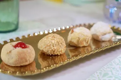 a plate of muffins with a cherry on it at Chic Angolo di Anita in Palermo