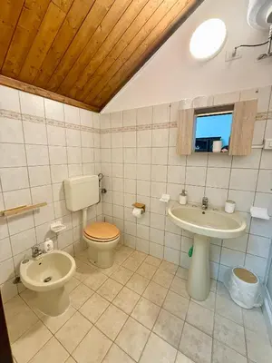 a bathroom with a toilet and a sink at Dimora Anastasia - Alloggio nel cuore di Balestrate in Balestrate