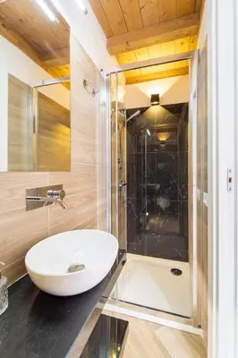 a bathroom with a sink and a shower at Casa Clio - Mondello Home in Palermo