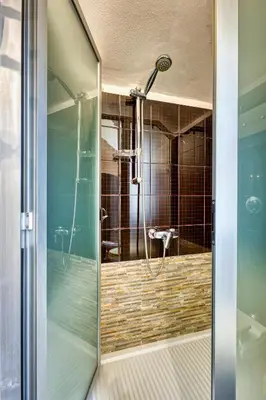 a shower with a glass door in a bathroom at VFH Villa Cala del Cuore con piscina, 50 m dal mare in Santa Flavia
