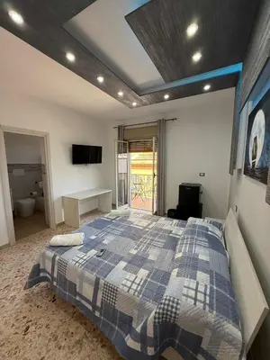 an office with a large clock on the wall at nuova oreto stazione rooms in Palermo
