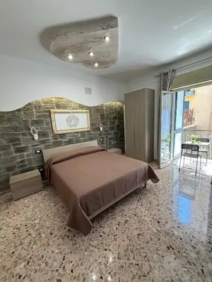a bathroom with a toilet and a tub and a sink at nuova oreto stazione rooms in Palermo