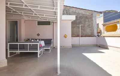 a patio with awning on top of a building at Amazing Apartment In Trappeto With Wifi in Trappeto