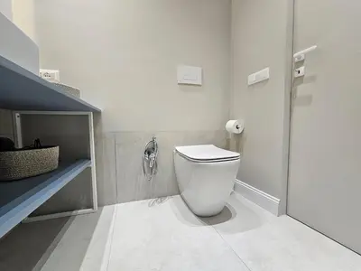 a white bathroom with a toilet and a shower at Dolce Dormire in Palermo