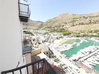 a view from a balcony of a marina at Vue Merveilleuse Apartment in Castellammare del Golfo