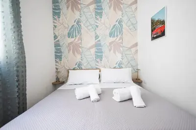 a bedroom with a bed with two pillows at inHouse Palermo in Palermo