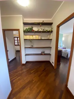a living room with a staircase with plants on it at Casa Mini' in Palermo