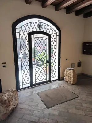 a room with a large door with a window at Bellini al Massimo in Palermo