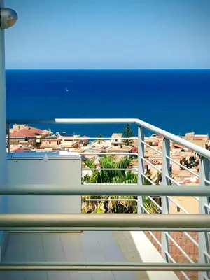 a balcony with a view of the ocean at Sole Blue Apartment in Balestrate