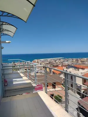 a balcony with a view of the ocean at Sole Blue Apartment in Balestrate