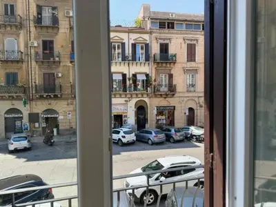 a view from a window of a street with parked cars at Casetta Lulù Palermo centro in Palermo