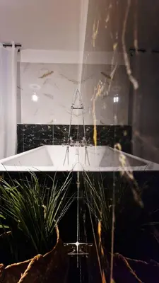 a bathroom with a sink and a mirror at Villa Domus Dea Mondello in Mondello