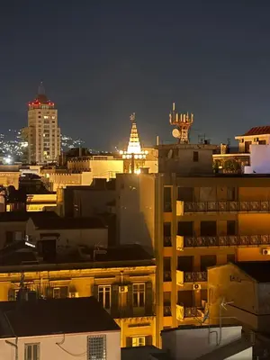a view of a city at night with buildings at Cavour59 in Palermo