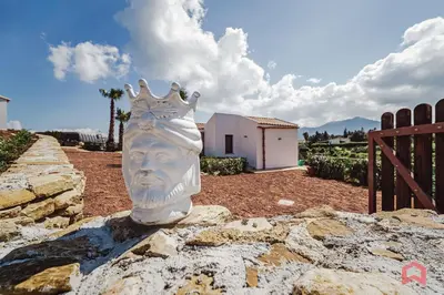 a balcony with a view of a mountain at Panoramic Villa with private Pool near Scopello in Scopello