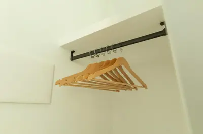 a rack of wooden utensils hanging from a wall at Limes in Palermo