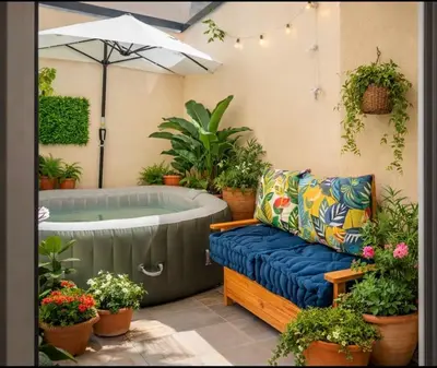 a soaking tub with a couch and plants at Colonna Secret, Private Jacuzzi in Historic Center in Palermo