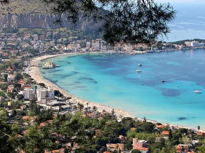 a view of a beach with boats in the water at Ashur Mondello, sapore di sale in Palermo