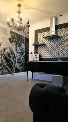 a living room with a couch and a chandelier at zaraholiday24 in Palermo