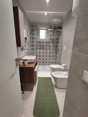 a bathroom with a sink and a toilet and a shower at Molly house in Palermo