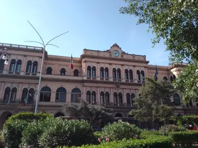a large building with a clock on top of it at Kala Flat by Holiday World in Palermo