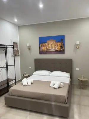 a bedroom with a large bed with two pillows at Holiday home tom in Palermo