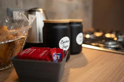 a table with a jar of coffee and a box of chocolates at Il Palchetto in Palermo