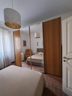 a bedroom with a bed and a mirror at Emily's Place in Palermo