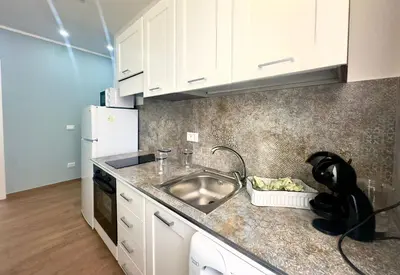 a kitchen with a sink and a counter top at MD Apartament Coral Bahalara 2 in Palermo