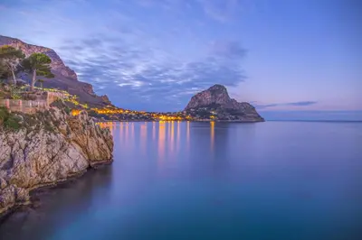 a view of a large body of water with mountains at SOLUNTUM - locazione turistica in Santa Flavia