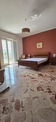 a large bedroom with a large bed in a room at SOLUNTUM - locazione turistica in Santa Flavia