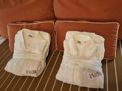 a large bed in a room with a fireplace at Zahira suite&spa in Palermo