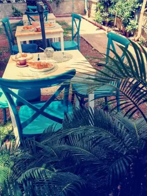 a table with a plate of food on it at B&B Magnolie in Palermo