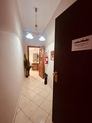 a hallway with a door leading to a room at Mongitore 15 in Palermo