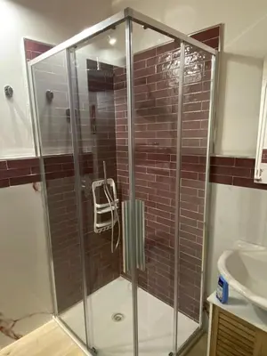 a glass shower in a bathroom with a sink at Le Gemme di Ballarò in Palermo