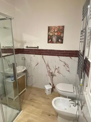 a bathroom with a toilet and a sink at Le Gemme di Ballarò in Palermo