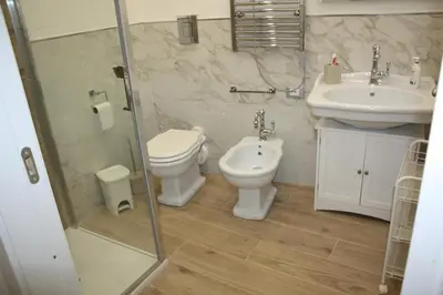 a bathroom with a toilet and a sink at Le Gemme di Ballarò in Palermo