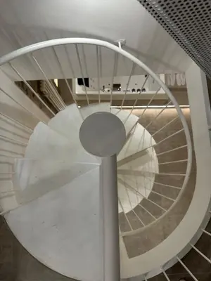 a spiral spiral staircase in a building with a spiral at House Spa Palermo in Palermo