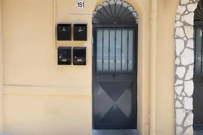 a black door on the side of a building at Ramona House in Palermo