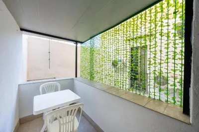 a room with a white table and a window at Ramona House in Palermo